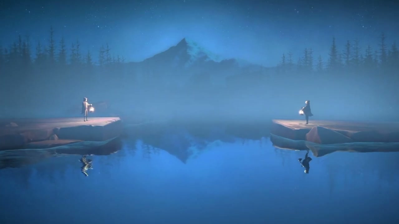 Jake standing beside a lake reflecting the mountains and forest in the Endless Night teaser